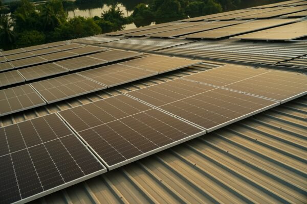 Technology solar cell, Engineer service check installation solar cell on the roof of factory. technician checks the maintenance of the solar panels, engineering team working on checking and maintenance in solar power plant to innovation of green energy for life on factory roof.